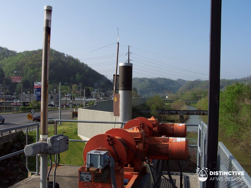 Service provided to rainfall and water level ALERT monitoring station atop flood wall protecting Harlan, Kentucky